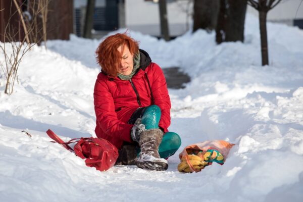 woman slipping on icy sidewalk