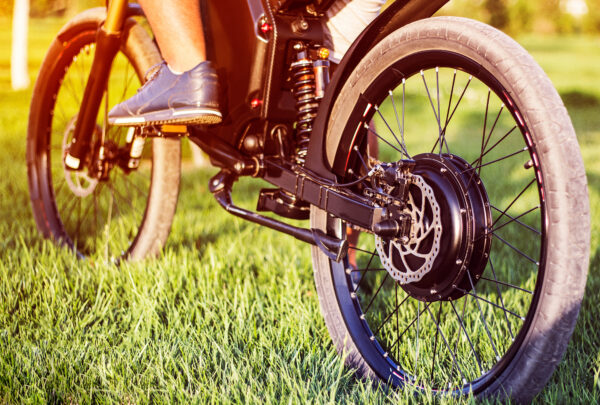 Man biker sitting on electric bike. Ebike bicycle environmentally friendly eco e-mountainbike transport. Healthy lifestyle