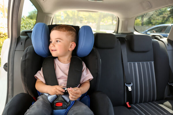 Baby boy buckled in car seat